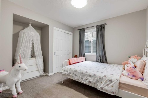 22 Osborne Common Sw, Airdrie, AB - Indoor Photo Showing Bedroom