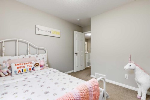 22 Osborne Common Sw, Airdrie, AB - Indoor Photo Showing Bedroom