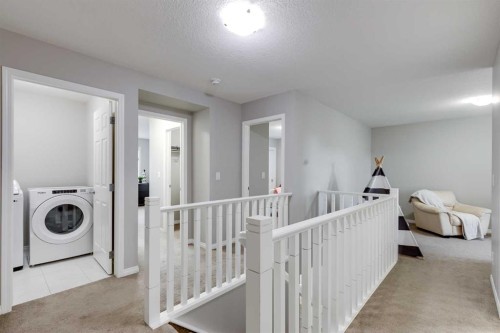 22 Osborne Common Sw, Airdrie, AB - Indoor Photo Showing Laundry Room