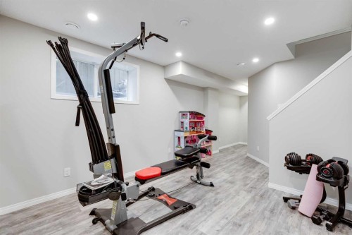 22 Osborne Common Sw, Airdrie, AB - Indoor Photo Showing Gym Room
