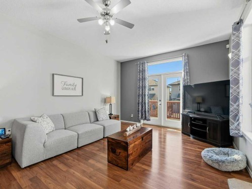 106 Springs Place Se, Airdrie, AB - Indoor Photo Showing Living Room