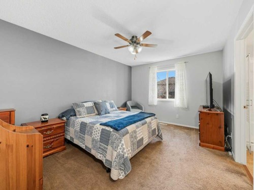 106 Springs Place Se, Airdrie, AB - Indoor Photo Showing Bedroom