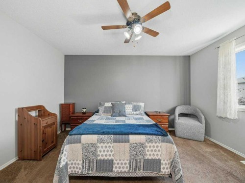 106 Springs Place Se, Airdrie, AB - Indoor Photo Showing Bedroom
