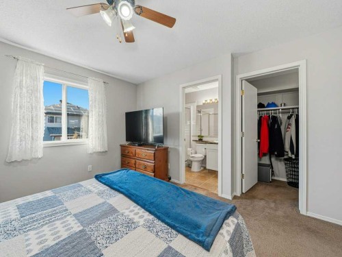 106 Springs Place Se, Airdrie, AB - Indoor Photo Showing Bedroom