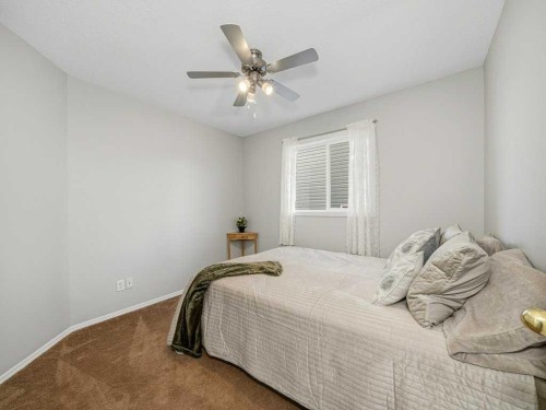 106 Springs Place Se, Airdrie, AB - Indoor Photo Showing Bedroom