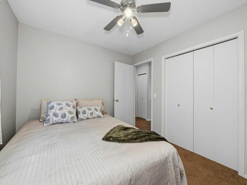 106 Springs Place Se, Airdrie, AB - Indoor Photo Showing Bedroom