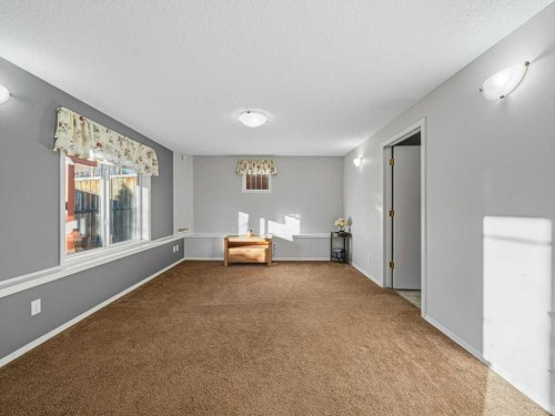 106 Springs Place Se, Airdrie, AB - Indoor Photo Showing Other Room