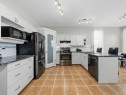 106 Springs Place Se, Airdrie, AB  - Indoor Photo Showing Kitchen With Upgraded Kitchen 