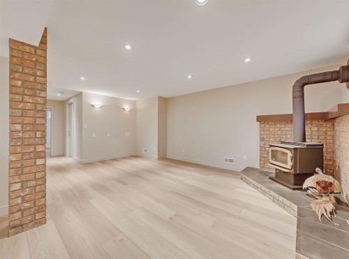 44 Granlea Place Sw, Calgary, AB - Indoor With Fireplace