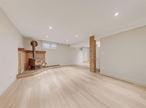 44 Granlea Place Sw, Calgary, AB - Indoor With Fireplace