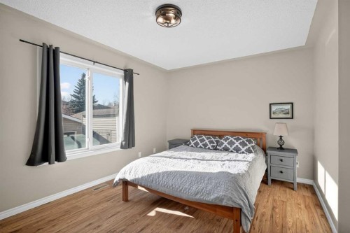 107 Mt Allan Circle Se, Calgary, AB - Indoor Photo Showing Bedroom