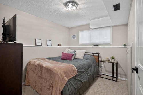 107 Mt Allan Circle Se, Calgary, AB - Indoor Photo Showing Bedroom