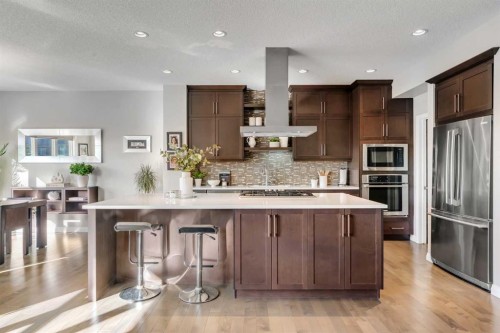 53 Sundown Grove, Cochrane, AB - Indoor Photo Showing Kitchen With Upgraded Kitchen