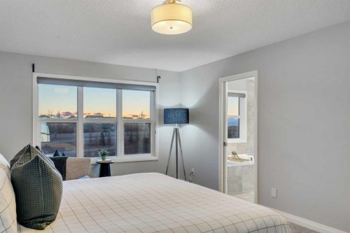 53 Sundown Grove, Cochrane, AB - Indoor Photo Showing Bedroom