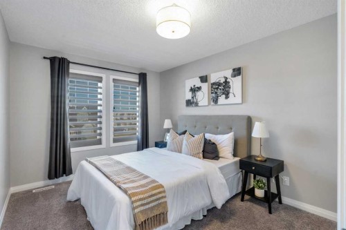 53 Sundown Grove, Cochrane, AB - Indoor Photo Showing Bedroom