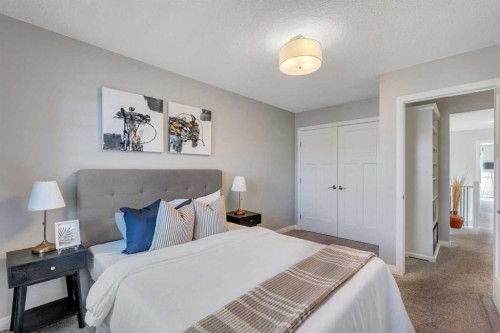 53 Sundown Grove, Cochrane, AB - Indoor Photo Showing Bedroom