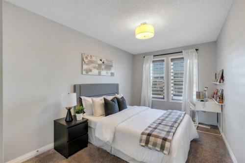 53 Sundown Grove, Cochrane, AB - Indoor Photo Showing Bedroom