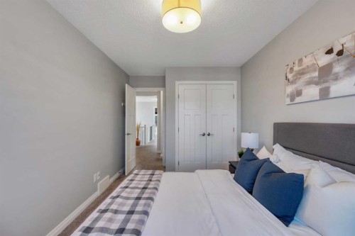 53 Sundown Grove, Cochrane, AB - Indoor Photo Showing Bedroom