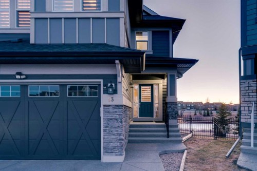 53 Sundown Grove, Cochrane, AB - Outdoor With Facade
