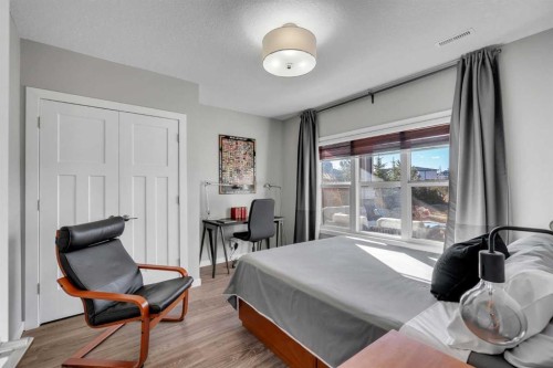 53 Sundown Grove, Cochrane, AB - Indoor Photo Showing Bedroom