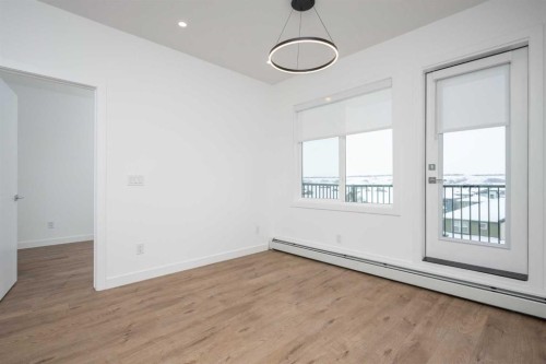 1406-111 Wolf Creek Drive Se, Calgary, AB - Indoor Photo Showing Other Room