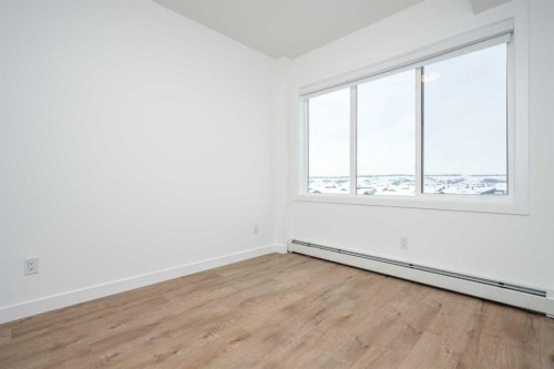 1406-111 Wolf Creek Drive Se, Calgary, AB - Indoor Photo Showing Other Room