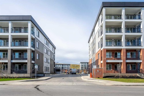 1406-111 Wolf Creek Drive Se, Calgary, AB - Outdoor With Facade
