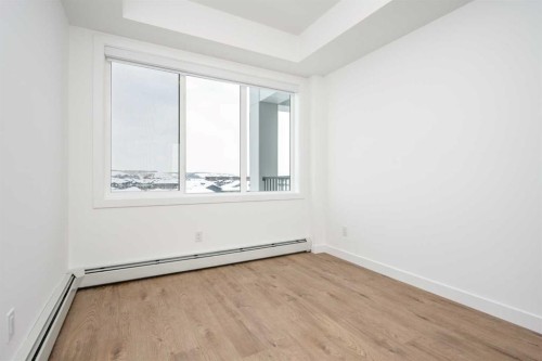 1406-111 Wolf Creek Drive Se, Calgary, AB - Indoor Photo Showing Other Room