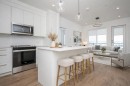 1406-111 Wolf Creek Drive Se, Calgary, AB  - Indoor Photo Showing Kitchen With Upgraded Kitchen 