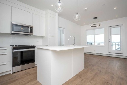 1406-111 Wolf Creek Drive Se, Calgary, AB - Indoor Photo Showing Kitchen With Upgraded Kitchen