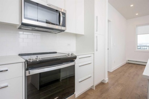 1406-111 Wolf Creek Drive Se, Calgary, AB - Indoor Photo Showing Kitchen
