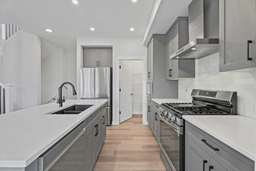 71 Ranchers View, Okotoks, AB - Indoor Photo Showing Kitchen With Double Sink With Upgraded Kitchen