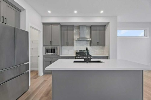 71 Ranchers View, Okotoks, AB - Indoor Photo Showing Kitchen With Double Sink With Upgraded Kitchen