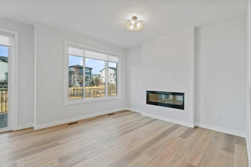 71 Ranchers View, Okotoks, AB - Indoor Photo Showing Living Room With Fireplace