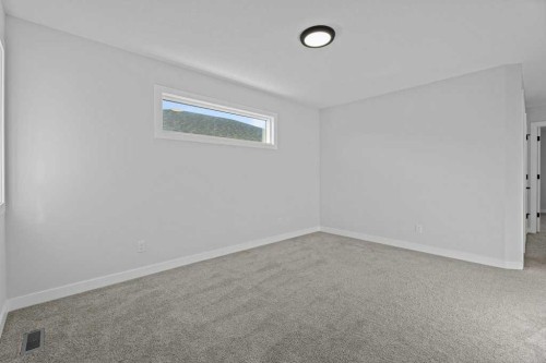 71 Ranchers View, Okotoks, AB - Indoor Photo Showing Other Room