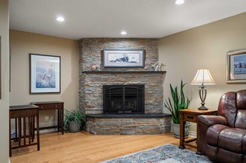 39 Echlin Drive, Bragg Creek, AB - Indoor Photo Showing Living Room With Fireplace