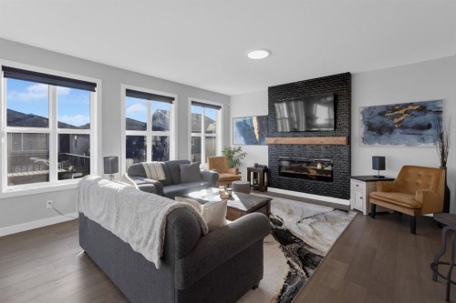 160 Precedence Hill, Cochrane, AB - Indoor Photo Showing Living Room With Fireplace