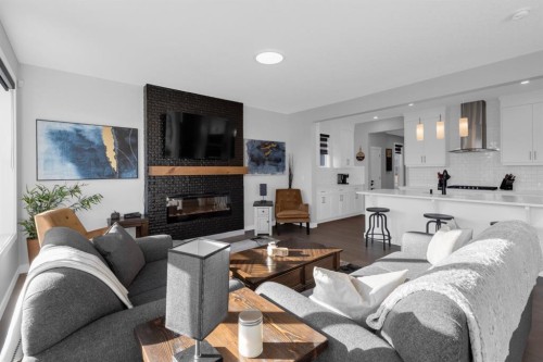 160 Precedence Hill, Cochrane, AB - Indoor Photo Showing Living Room With Fireplace