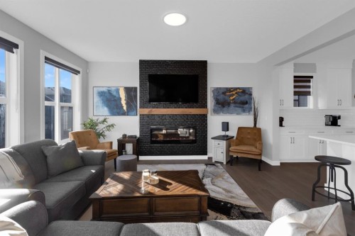 160 Precedence Hill, Cochrane, AB - Indoor Photo Showing Living Room With Fireplace