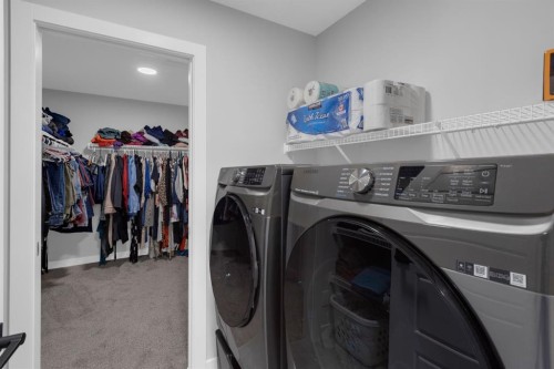 160 Precedence Hill, Cochrane, AB - Indoor Photo Showing Laundry Room