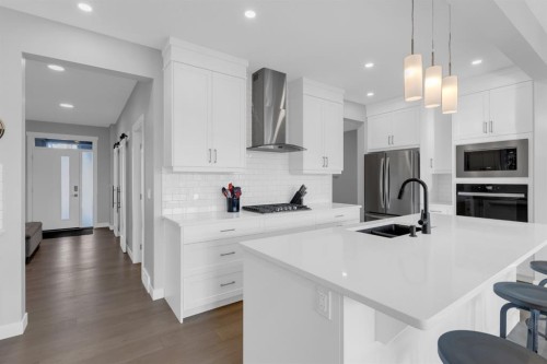 160 Precedence Hill, Cochrane, AB - Indoor Photo Showing Kitchen With Double Sink With Upgraded Kitchen