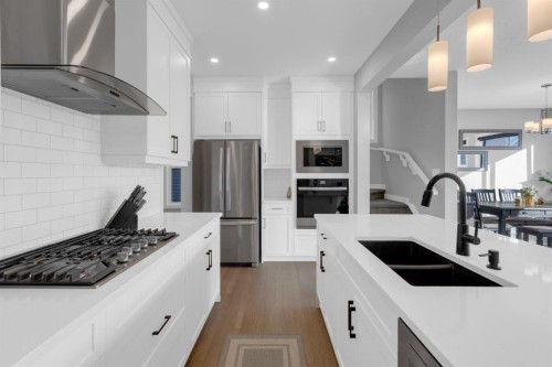 160 Precedence Hill, Cochrane, AB - Indoor Photo Showing Kitchen With Stainless Steel Kitchen With Double Sink With Upgraded Kitchen