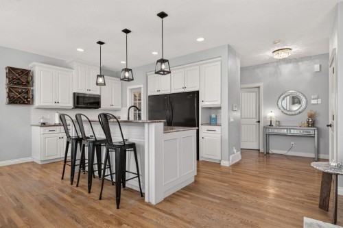 208 Cimarron Drive, Okotoks, AB - Indoor Photo Showing Kitchen With Upgraded Kitchen