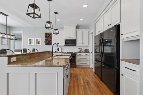 208 Cimarron Drive, Okotoks, AB - Indoor Photo Showing Kitchen With Upgraded Kitchen