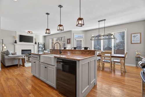 208 Cimarron Drive, Okotoks, AB - Indoor Photo Showing Other Room With Fireplace