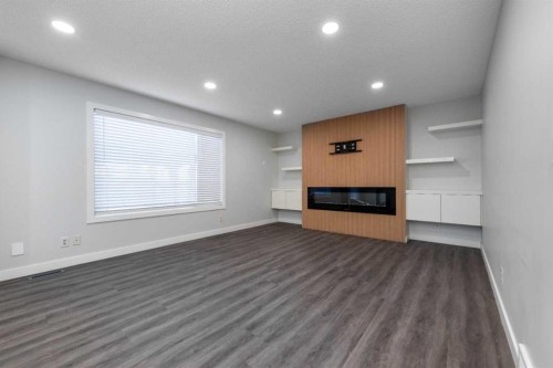 83 Cranleigh Common Se, Calgary, AB - Indoor With Fireplace