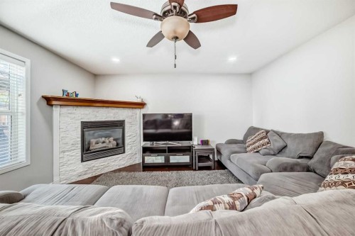 574 Chaparral Drive Se, Calgary, AB - Indoor Photo Showing Living Room With Fireplace
