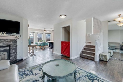 31 Inverness Grove Se, Calgary, AB - Indoor Photo Showing Living Room With Fireplace