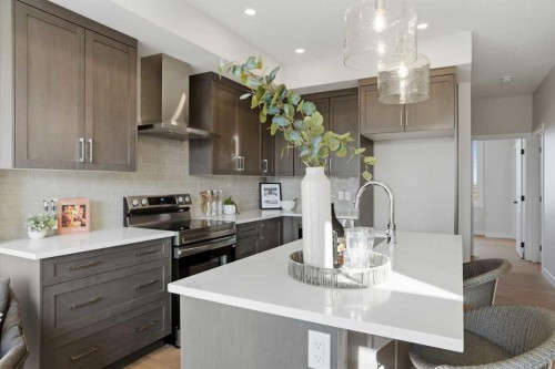 129 Wild Rose Way Se, Calgary, AB - Indoor Photo Showing Kitchen With Upgraded Kitchen