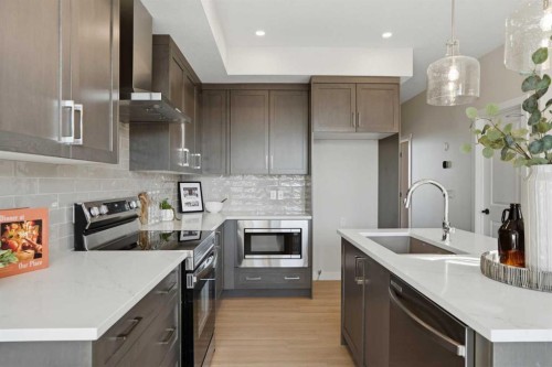 129 Wild Rose Way Se, Calgary, AB - Indoor Photo Showing Kitchen With Upgraded Kitchen